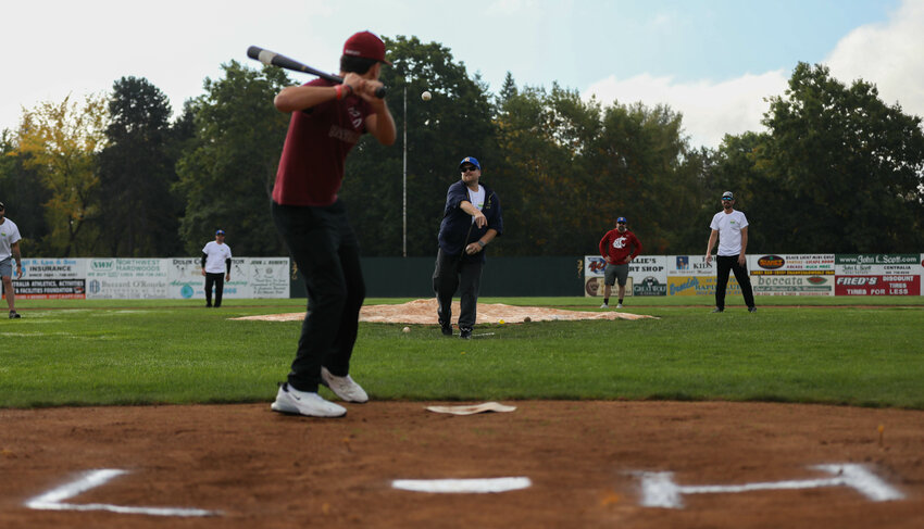 Erik Heinz throws a pitch during a wiffle ball game in celebration of his father, Larry Heinz, on Oct. 1 at Wheeler Field.