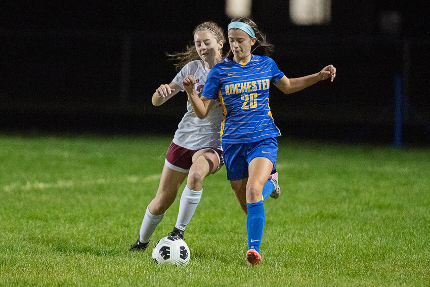 Rochester's Kailyn Beck shields off W.F. West's Trinity Gist during the first half of the Warriors' home match against the Bearcats on Oct. 3.