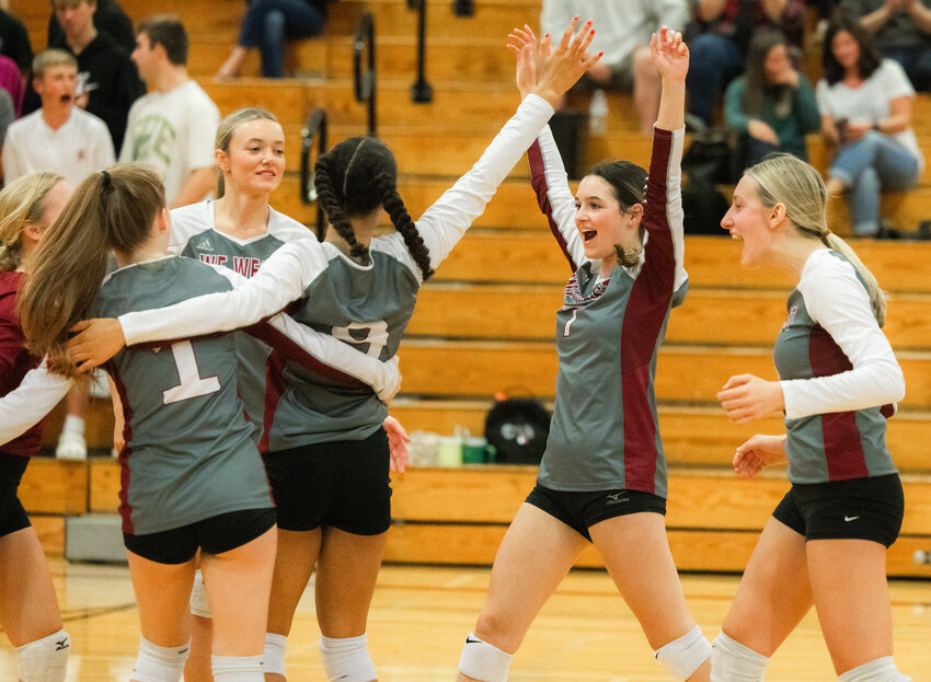 Bearcats celebrate a point during a match against Rochester on Tuesday, Oct. 3, in Chehalis.