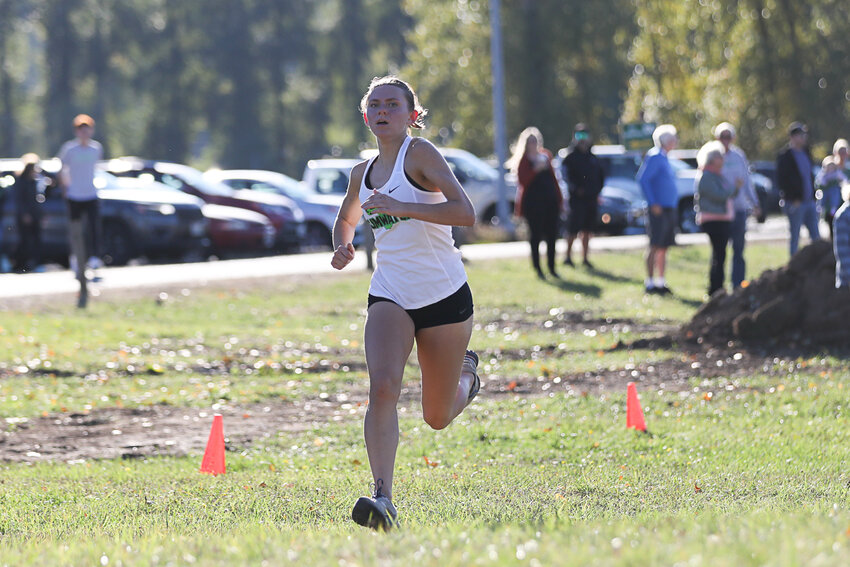 Annabelle Clapp approaches the finish line to win the girls' race at a 2A EvCo cross country meet at Stan Hedwall Park on Oct. 4.