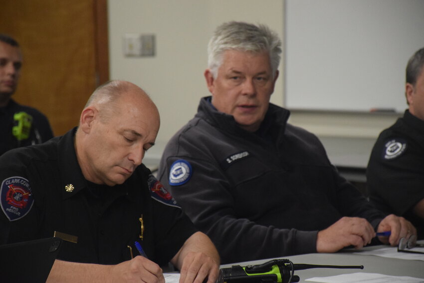 Clark-Cowlitz Fire Rescue Chief John Nohr, left, and Clark County Fire District 3 Chief Scott Sorenson take part in a joint-district meeting at CCFR&rsquo;s Dollar&rsquo;s Corner station Oct. 4.