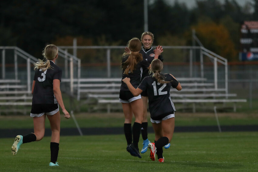 Grace Pancake celebrates her goal in the first half of Napavine's match against Toledo on Oct. 9.