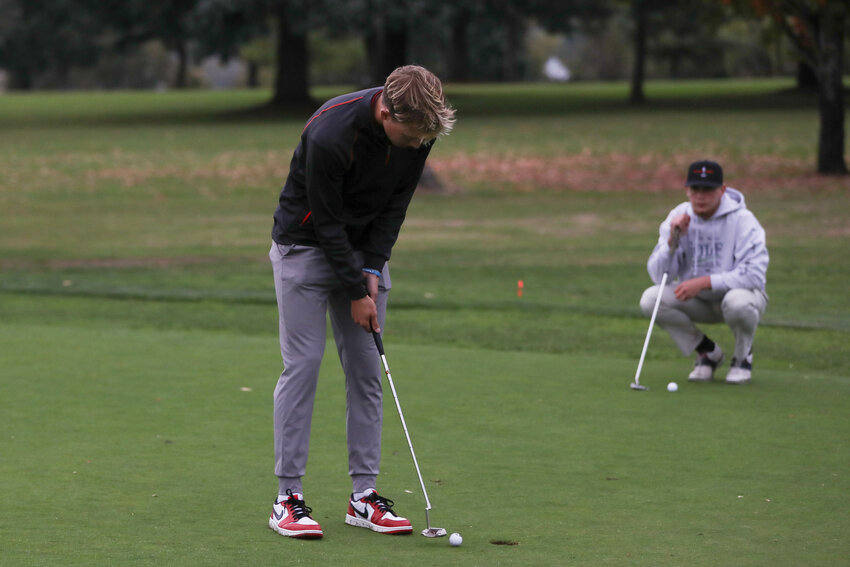 Weston Potter taps in a putt during W.F. West's matchup with Centralia at Newaukum Golf Course on Oct. 9.