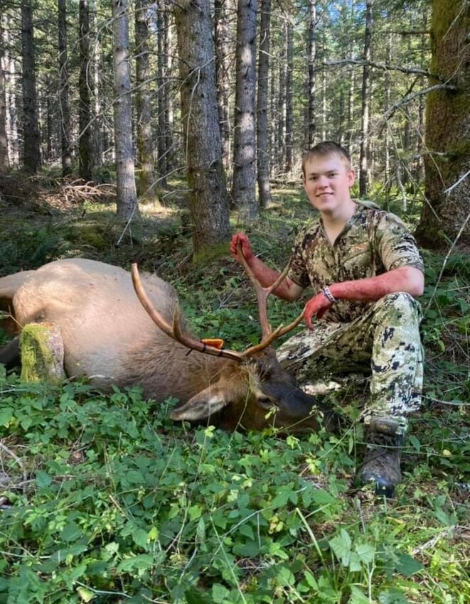 Owen Sharp, 15, of Centralia, with a bull elk he harvested.