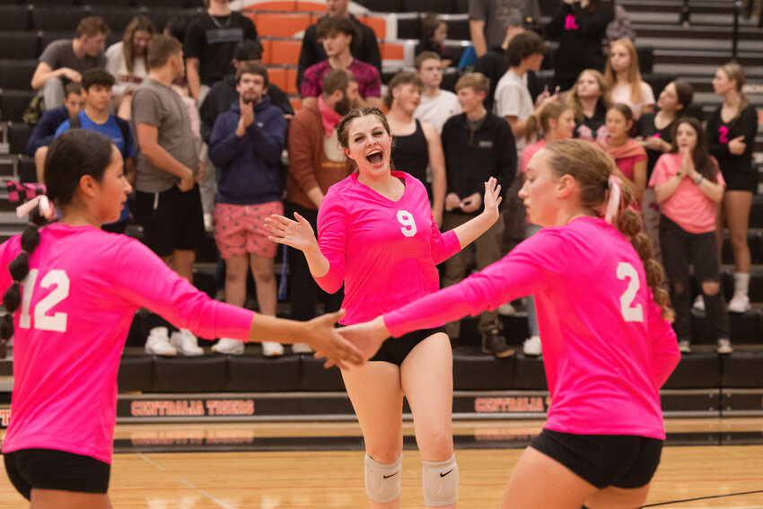 Tigers celebrate a point over the Warriors during a volleyball match in Centralia on Tuesday, Oct. 10.