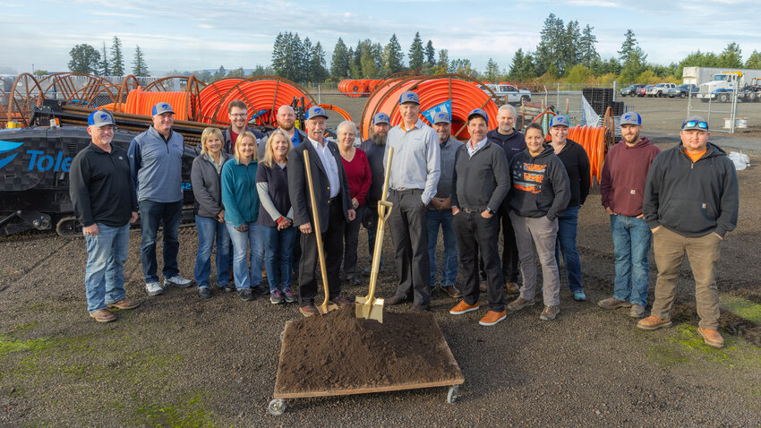 ToledoTel employees and partners pose for a photo during a groundbreaking ceremony for a new project to expand broadband in the Winlock area in October 2023.