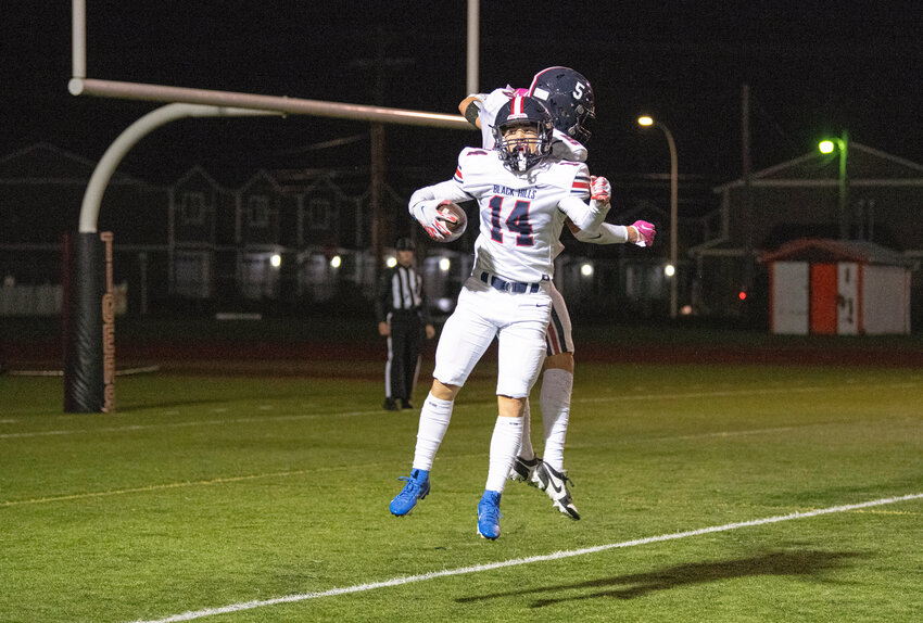 Black Hills running back Anthony Estrada celebrates a touchdown with wide receiver Maddox Hodge in a Friday night game in Centralia.