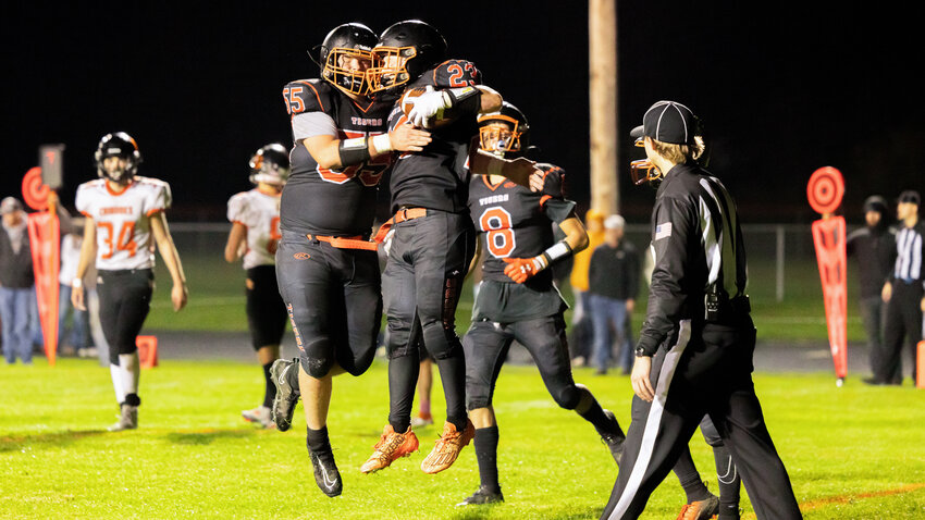 After reaching the end zone, Napavine running back Caleb Von Pressentin jumps for joy with Jonathon Harty during a home game against Kalama on Saturday.