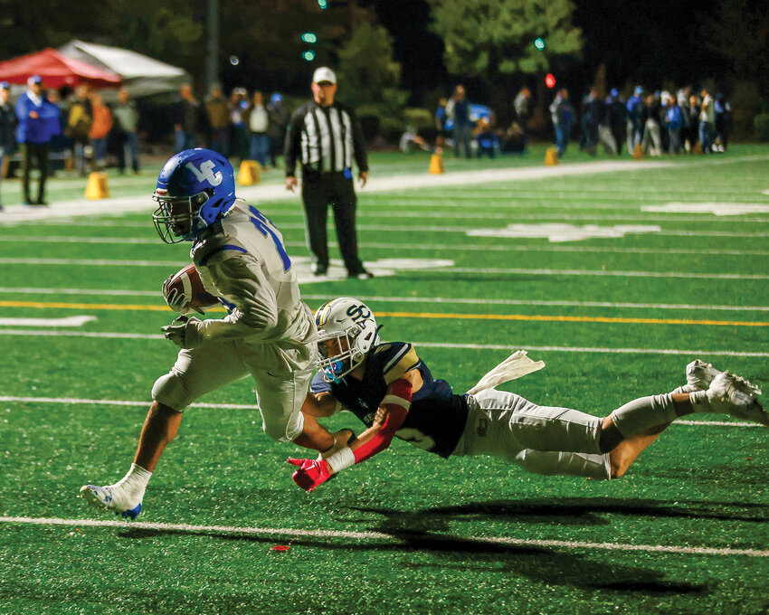 Jalen Ward crosses the goal line for La Center&rsquo;s first touchdown of the game in the fourth quarter of the Wildcats&rsquo; 14-13 win over the Seton Catholic Cougars on Friday, Oct. 13.