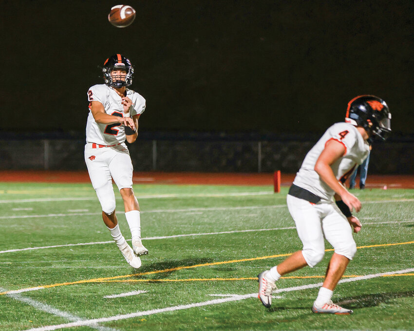 Battle Ground quarterback Ethan Adams throws a pass during the Tigers&rsquo; 48-30 league win over Union High School on Thursday, Oct. 12.