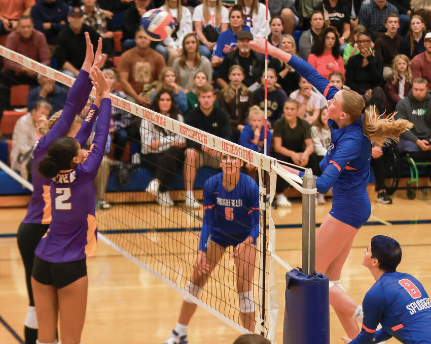 Ridgefield&rsquo;s 6-foot, 5-inch Stanford commit, Lizzy Andrew, spikes the ball over a Columbia River block attempt during the Spudders&rsquo; 0-3 loss to Columbia River High School on Tuesday, Oct. 10.