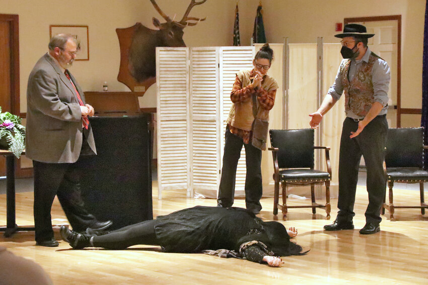 Tim Butterfield as Dr. Leo Turnbull, Holly Burkevics as Gemini, Ian Montgomery as Taurus and Bri Hines as Madame Zodiak perform at the Olympia Elks Lodge on Saturday, Oct. 14.