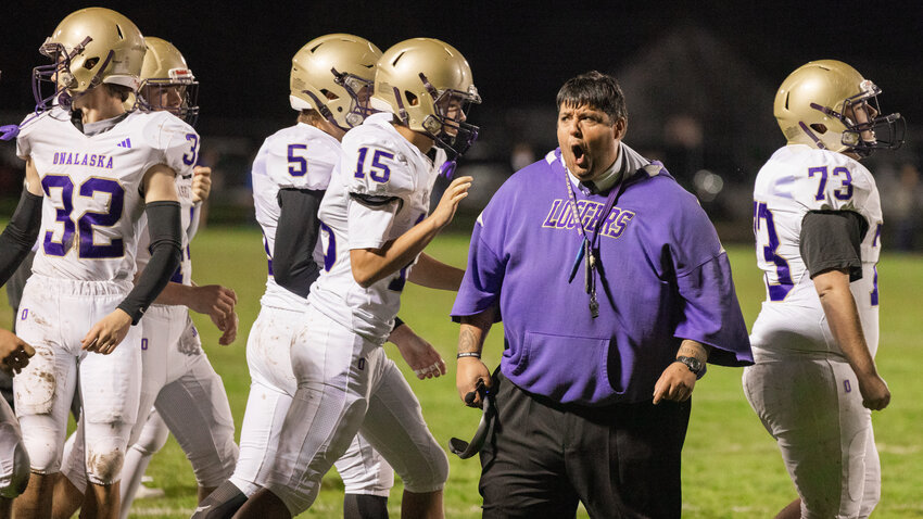 Onalaska Head Coach Mazen Saade yells as he celebrates a touchdown with the Loggers during a game against Adna Friday night at Pirate Stadium.