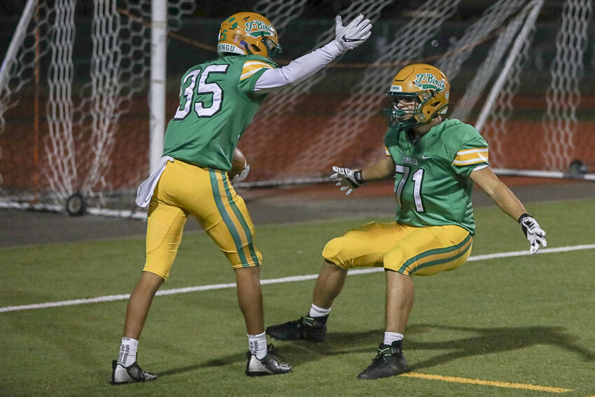 Tumwater players celebrate after a touchdown during their 54-6 win over Rochester Oct. 20.