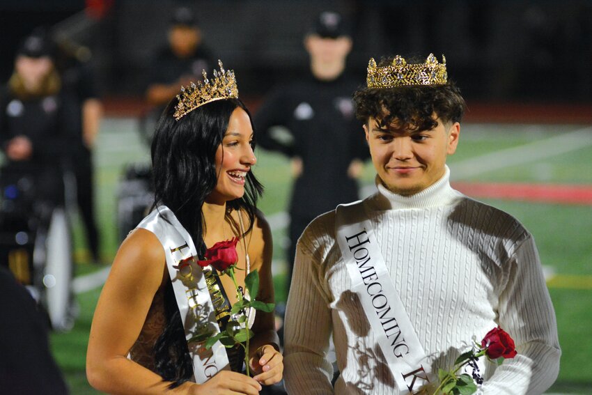 Yelm High School homecoming queen Madisyn Erickson and homecoming king Jason McCloud smile on Oct. 20 after it was announced the two were senior royalty.