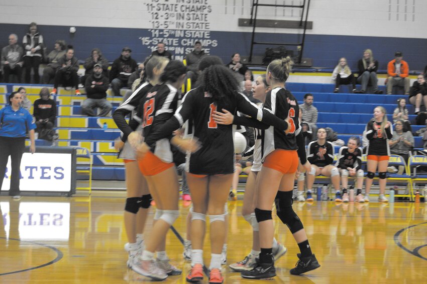 The Mountaineers huddle after Adna scores a point in a match at Adna High School on Oct. 25.