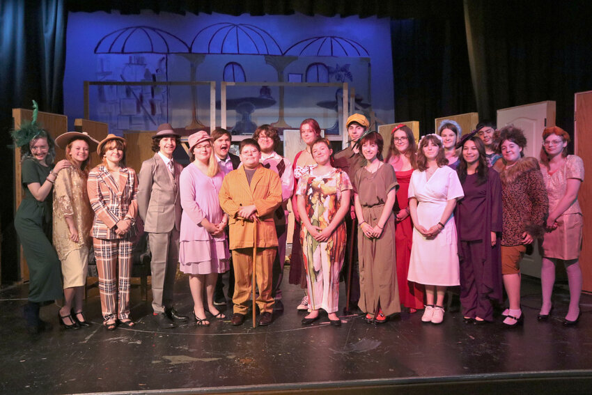 The cast of &ldquo;Clue&rdquo; poses for a photo on stage at Rochester High School during a rehearsal on Wednesday, Nov. 1.