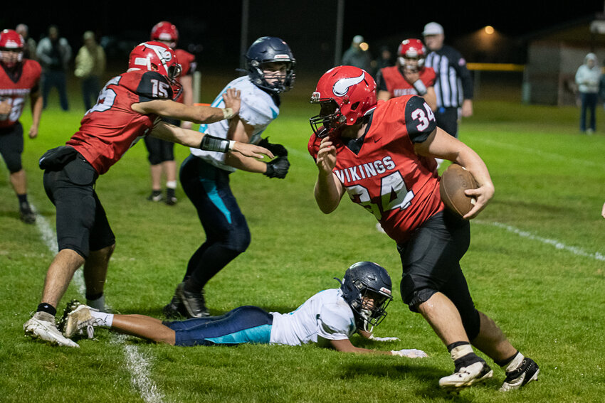 After breaking a tackle, Marshall Brockway sprints into the end zone during Mossyrock's 62-0 win over NW Christian (Lacey) in the 1B District crossover on Nov. 3 in Mossyrock.