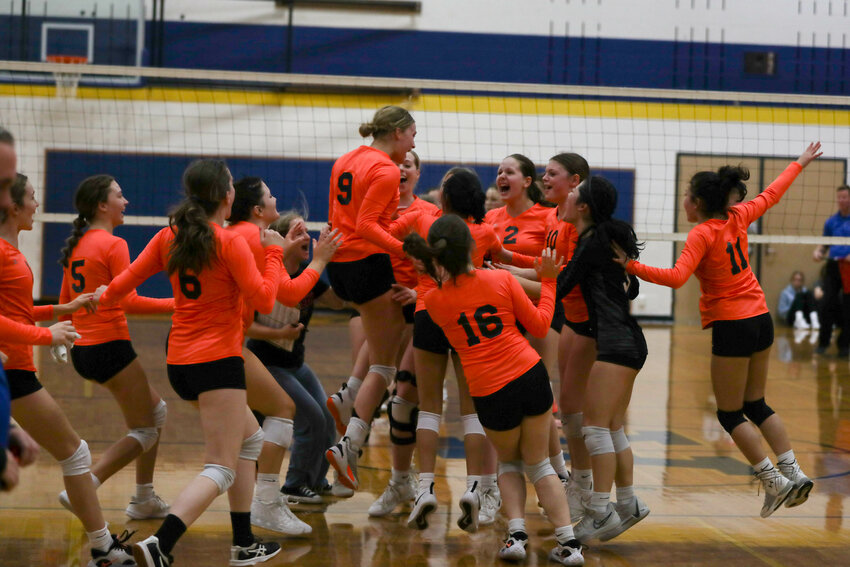 The Napavine Tigers celebrate after winning the third-place game in the 2B District 4 Tournament on Nov. 4 at Adna.