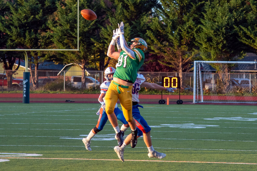 Beckett Wall hauls in a pass during Tumwater's 55-13 win over Ridgefield in a crossover on Nov. 4.