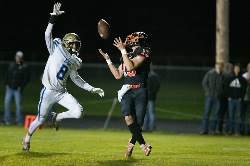 Conner Holmes brings in a touchdown reception in the first quarter of Napavine's crossover against Adna on Nov. 4.