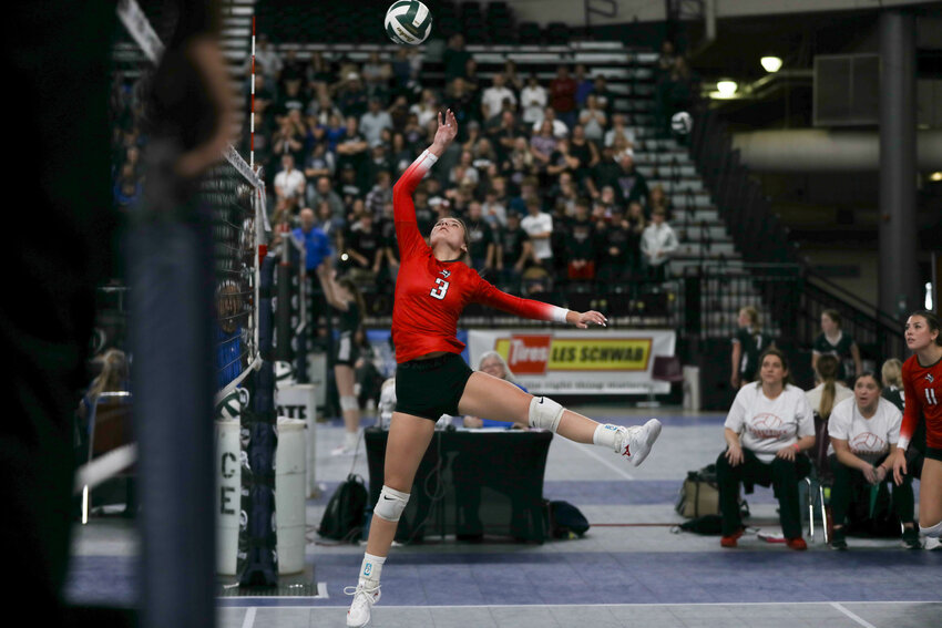 Erin Cournyer tips the ball over the net during Mossyrock's semifinal loss at the state tournament on Nov. 9 in Yakima.