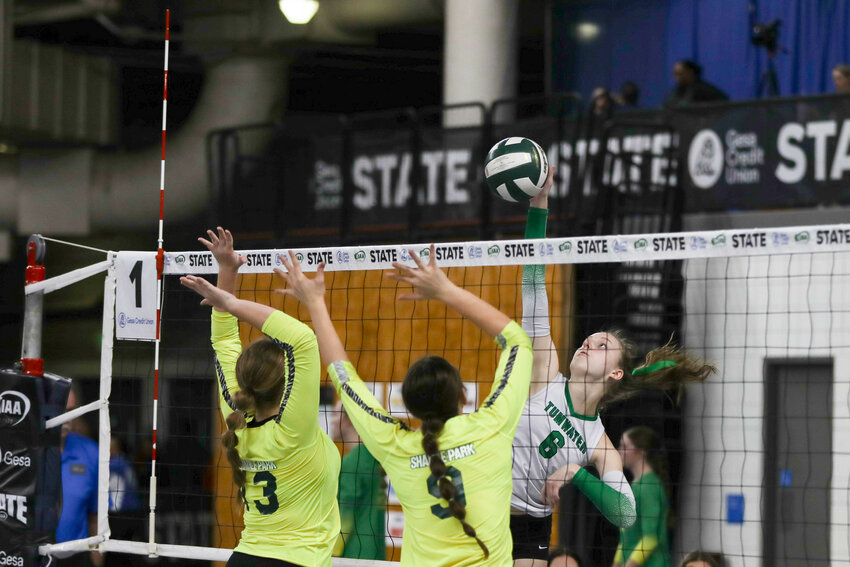 Whitney Van Gorkom hits the ball past two defenders during their first-round win over Shadle Park at the state tournament on Nov. 10 in Yakima.