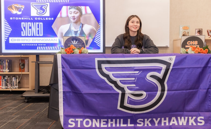 Chihiro Bringman smiles Tuesday evening at Centralia High School before signing to Stonehill College in Massachusetts.