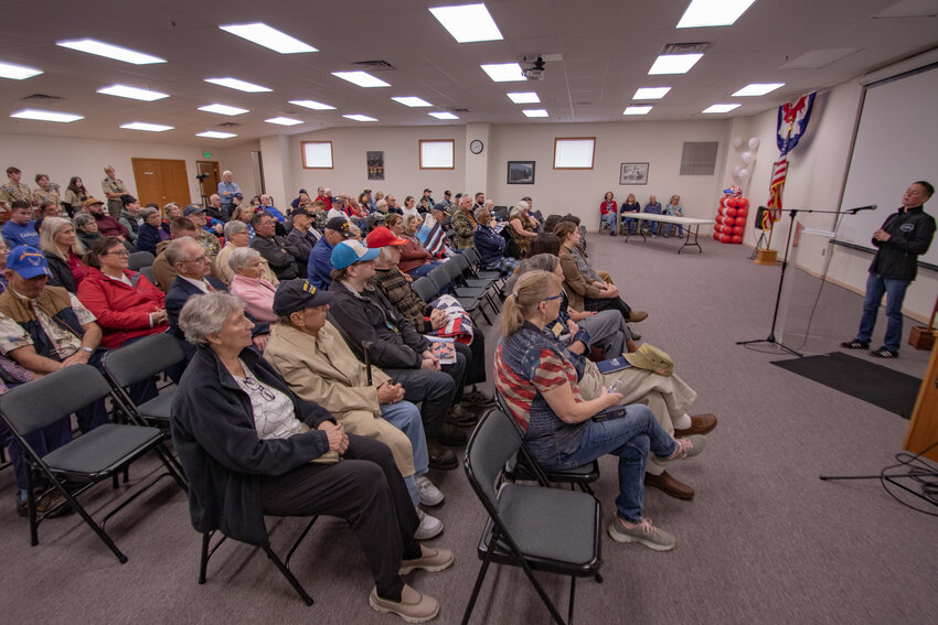Tabitha Hopp, a retired U.S. Army chief warrant officer 3, speaks to veterans and their family members at the Veterans Memorial Museum on Saturday, Nov. 11.