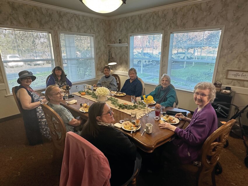 Attendees of Prestige Senior Living Rosemont&rsquo;s Thanksgiving luncheon smile as they enjoy a traditional Thanksgiving meal on Nov. 17.