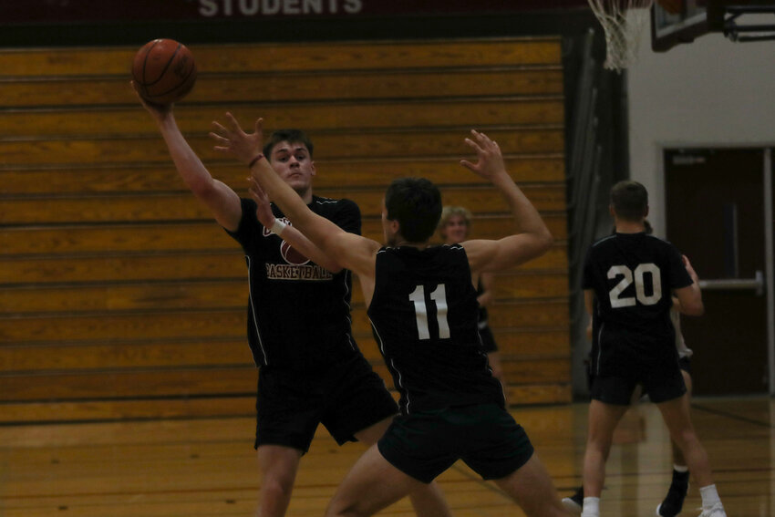 Parker Eiswald passes the ball past Grady Westlund during W.F. West's practice on Nov. 21.