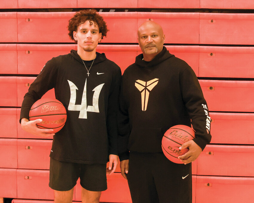 Battle Ground basketball&rsquo;s new father-son coaching duo: head coach Brett Johnson, right, brings years of experience while his son, Squeeky Johnson, brings post-college basketball knowledge to the Tigers.