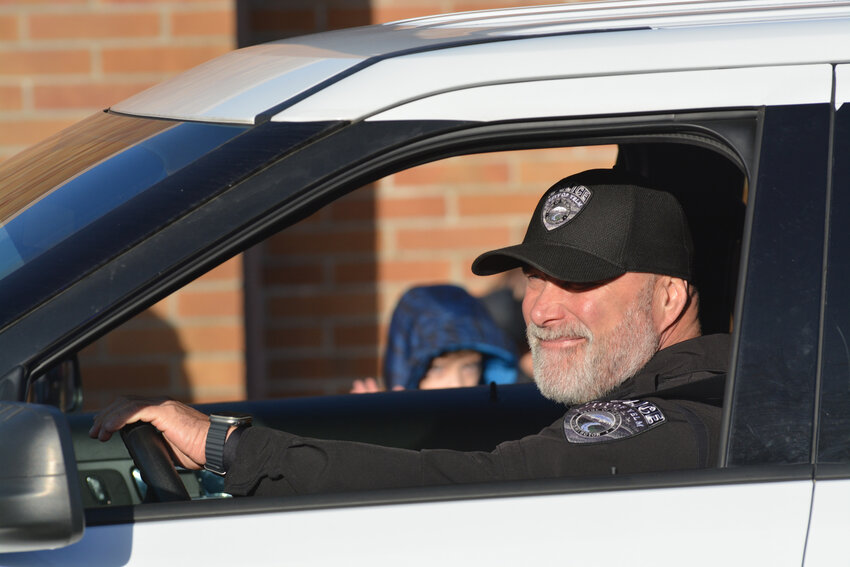 Yelm&rsquo;s Police Chief Rob Carlson smiles as he drives in the city&rsquo;s Christmas parade on Dec. 2.
