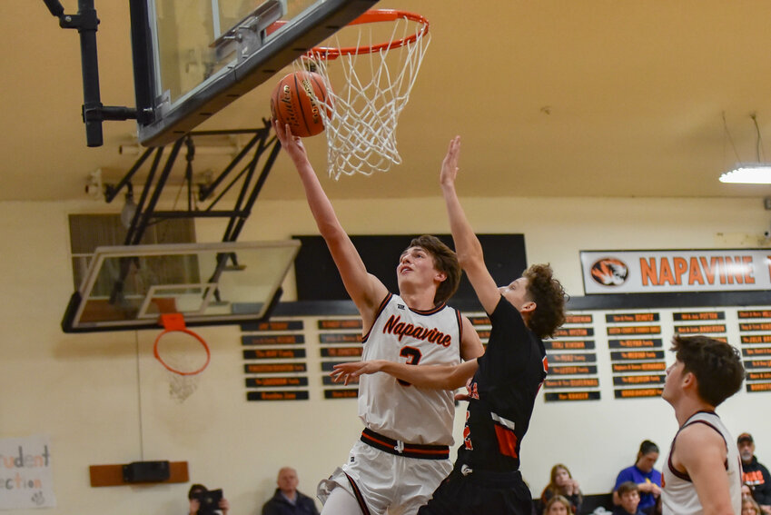 James Grose drives to the hoop during a 88-26 win over Kalama Dec. 9.