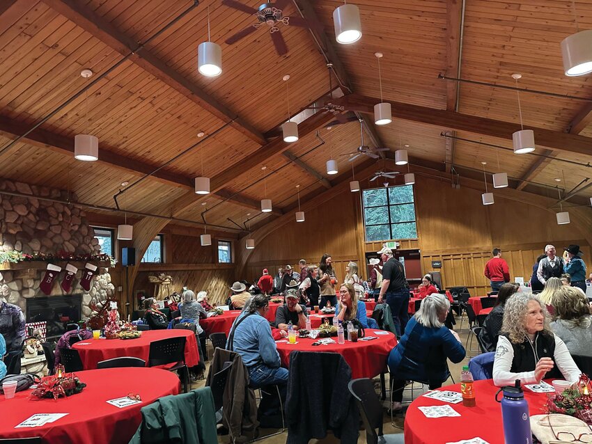 Those in attendance on Dec. 10 at the Pierce County Fair Ground for the Back Country Horsemen&rsquo;s Christmas party mingle prior to the party starting.