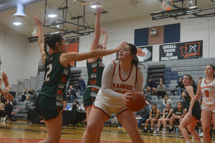 Haleigh Hanson is defended by two Morton-White Pass Timberwolves on Dec. 12.