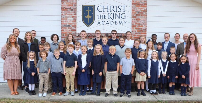 The Christ the King Academy class of 2023-2024 poses for a photo.