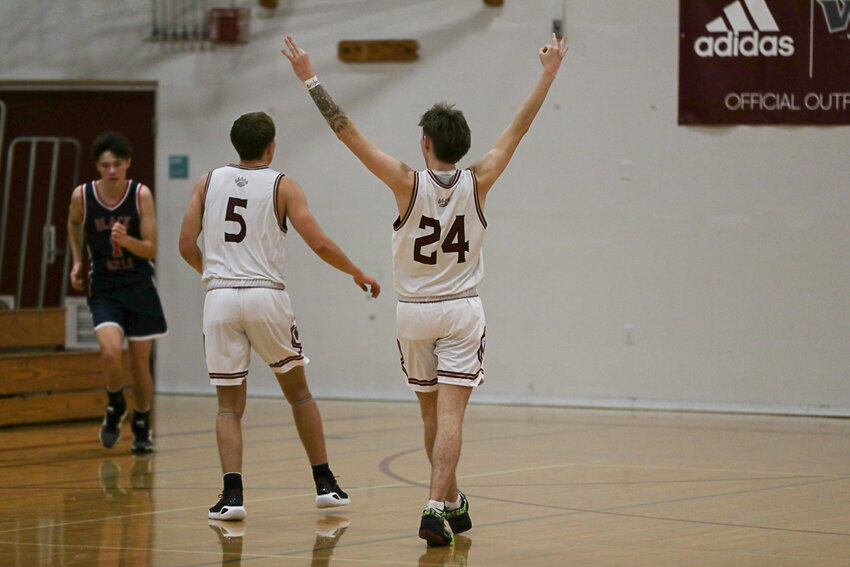 Tyler Klatush celebrates after a late Weston Potter 3-pointer during W.F. West's win over Black Hills on Dec. 15.