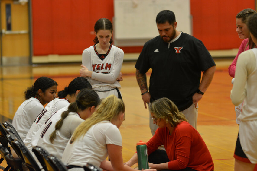 Coach Jennifer Sleeman draws up a play on Dec. 18 in overtime against North Kitsap. Yelm lost the contest, 58-55, to the Vikings.