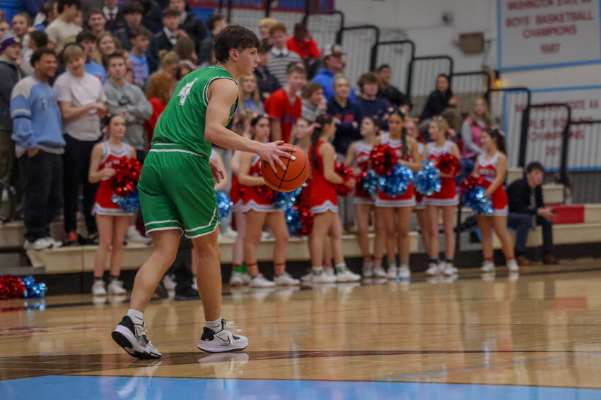 Nolan Campbell brings the ball up the court during Tumwater's 61-54 loss at Mark Morris on Dec. 19.