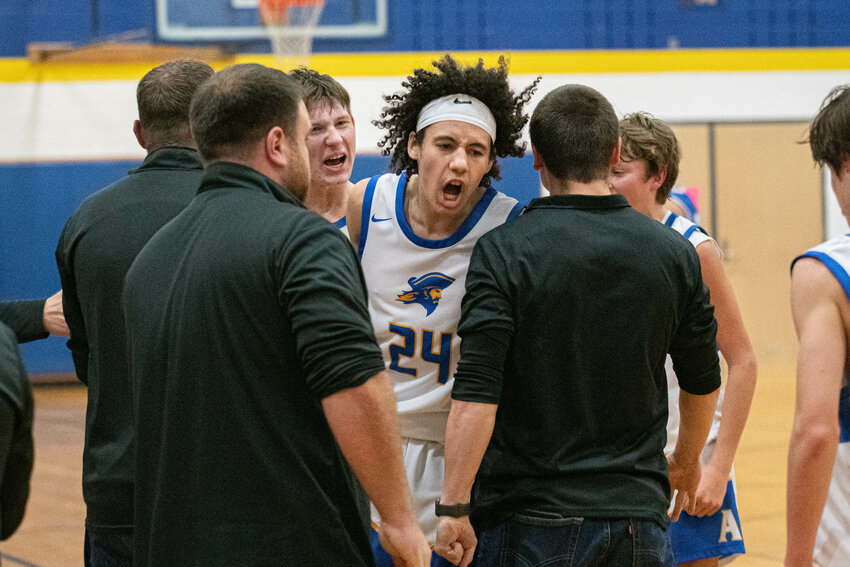 Jens Nielson celebrates after forcing overtime with a game-tying shot during Adna's 73-68 overtime win over La Center Dec. 19.