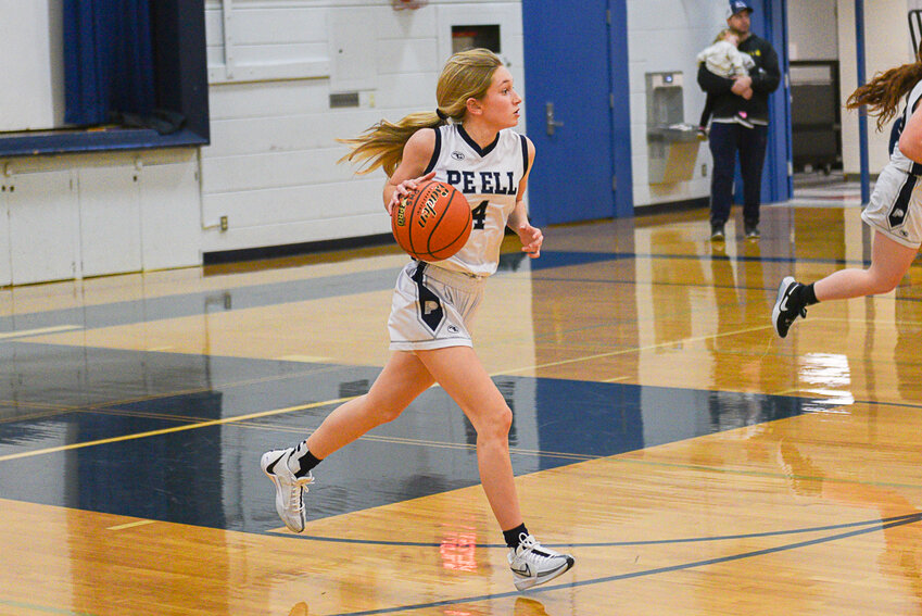 Karli Phelps dribbles down the court during Pe Ell's 48-41 win over Oakville on Dec. 20.