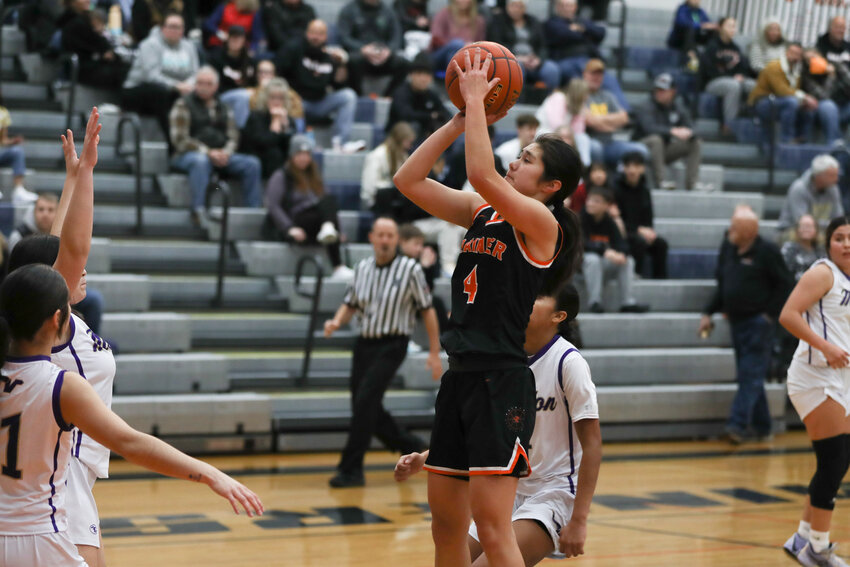 Angelica Askey pulls up for a jumper during the first half of Rainier's game against Mabton on Dec. 22.