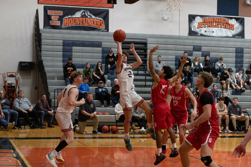 Jacob Meldrum shoots a fadeaway jumper during Rainier's loss to Brewster on Dec. 23.