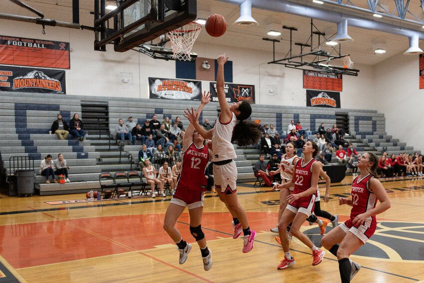 Angelica Askey drains a layup over a defender during Rainier's win over Brewster on Dec. 23.