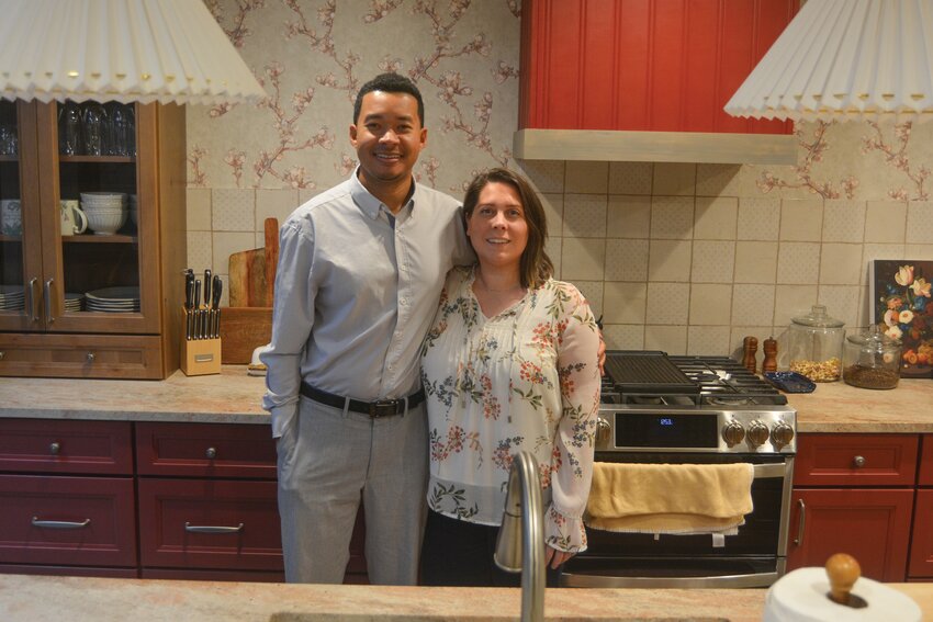 Josh and Jesse Flake pose in their renovated kitchen on Dec. 11.