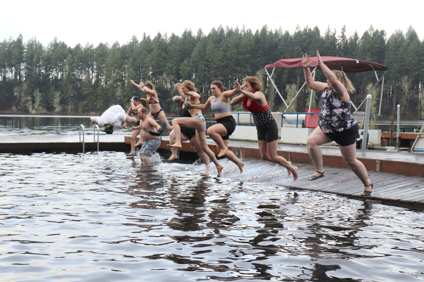 Polar Plunge participants jump into Offut Lake near Tenino on Jan. 1. Approximately 150 people, jumping in groups of eight, participated in the Offut Lake Resort&rsquo;s New Year&rsquo;s Day tradition this year.  The annual event began with breakfast at Lady of the Lake. This year, donations were raised for Bucoda Mayor Rob Gordon, who is battling cancer. Donations can be made to the Robert Gordon Cancer Fund at any WSECU branch. Money can also be donated to Gordon and his family on Venmo: Miriam-Gordon-13.