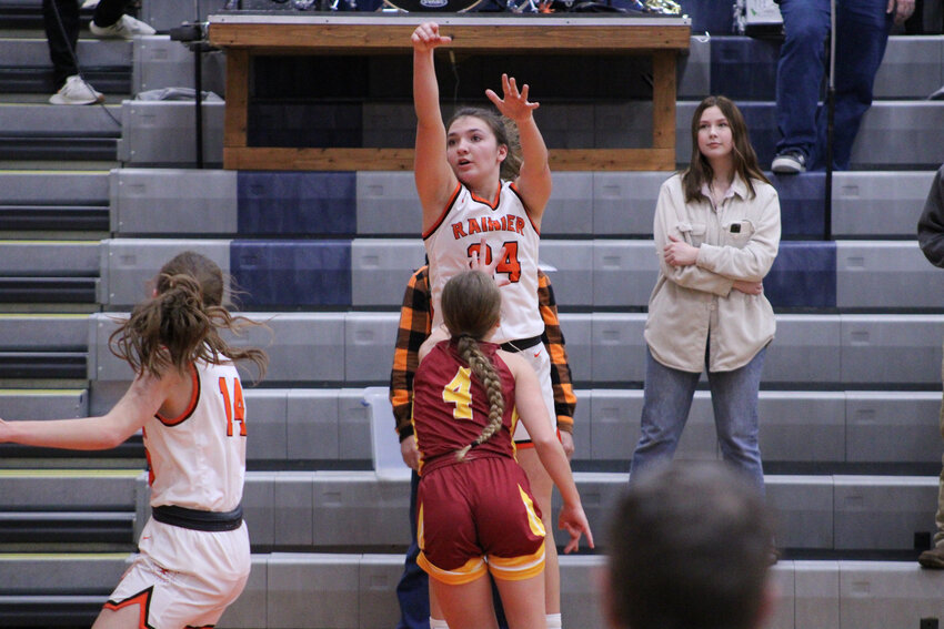 Bryn Beckman shoots a 3-pointer over a Winlock defender on Jan. 3. Beckman's 17 points were enough to outscore Winlock's total of 14.