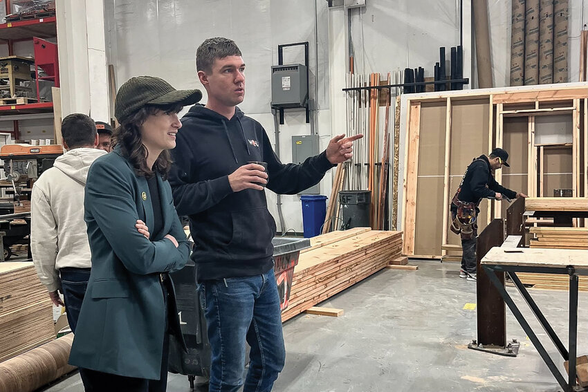 U.S. Rep. Marie Gluesencamp Perez (WA-03) visits with someone at Wolf Industries in Battle Ground on her tour of Clark County manufacturers last week.