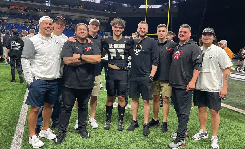 Brayden Platt poses for a photo with members of the Yelm football coaching staff at the 2024 All-American Bowl on Jan. 6.